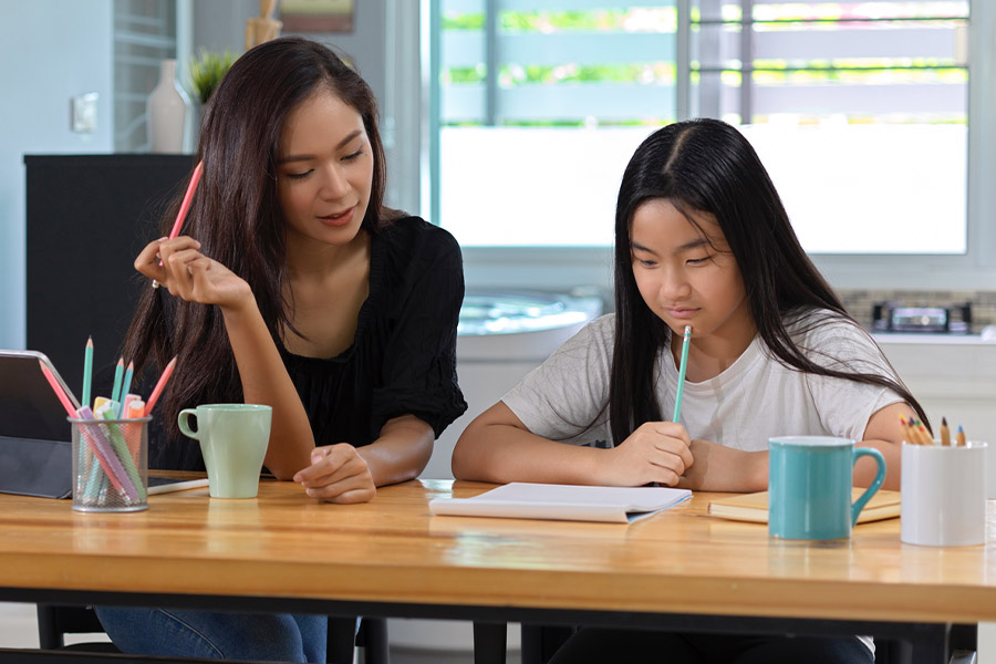 student and tutor together at a desk in Fort Worth